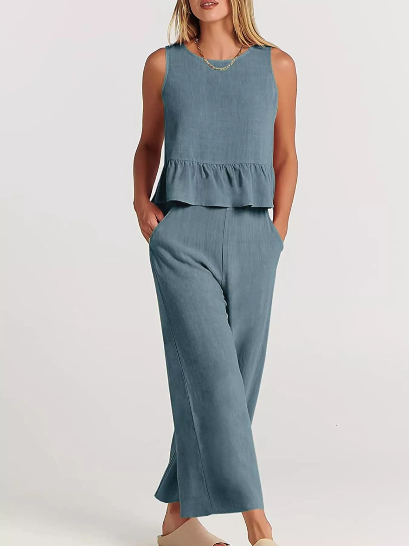 Trendsi plus size set featuring a sleeveless peplum top and wide-leg trousers in blue