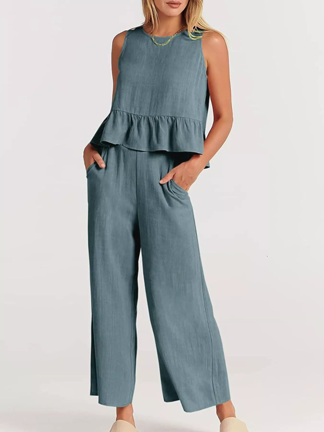 Trendsi set plus size featuring a peplum top and wide-leg trousers in a soft blue shade