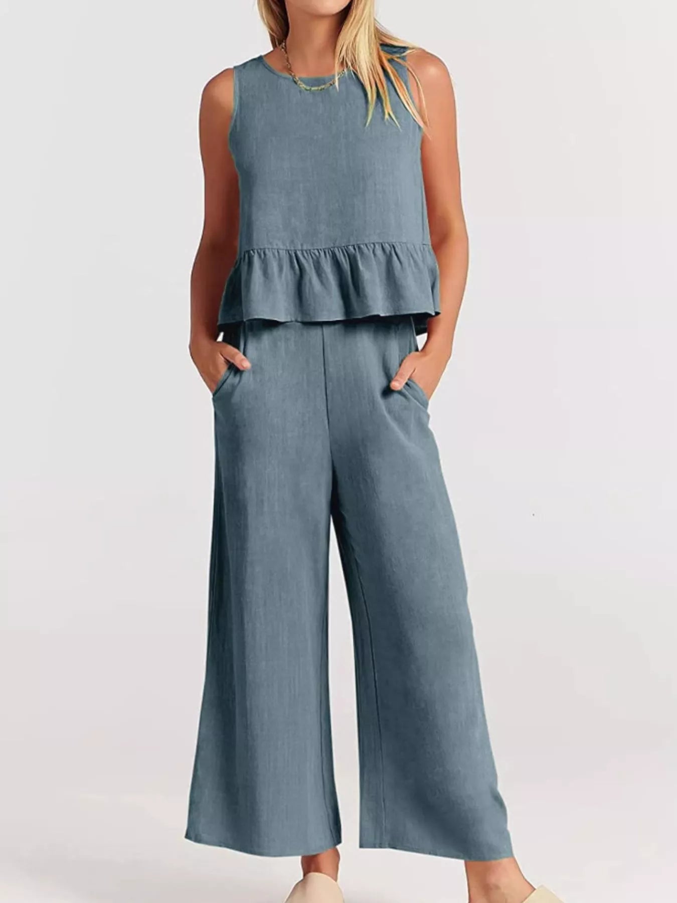 Trendsi set plus size featuring a peplum top and wide-leg trousers in soft blue fabric