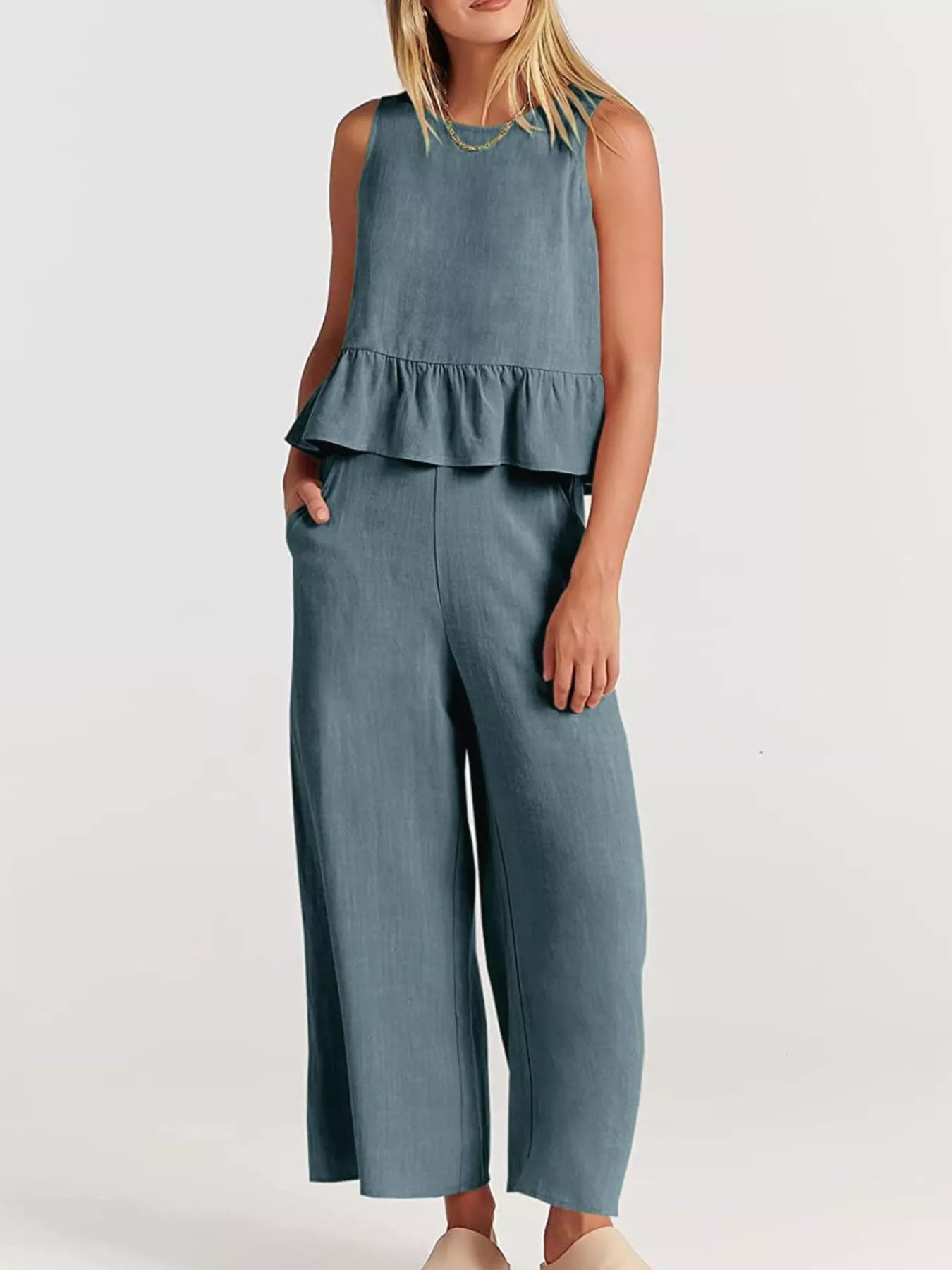Trendsi set plus size featuring a peplum top and wide-leg trousers in soft denim blue