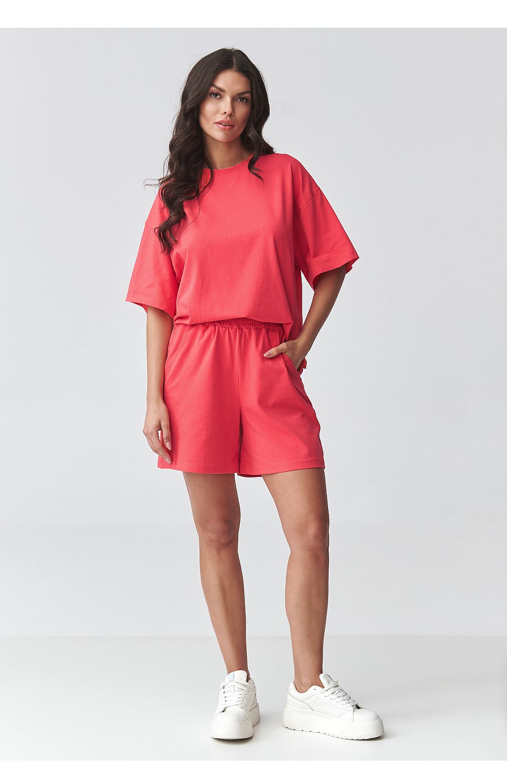 Makadamia set short sleeve blouse paired with matching shorts in vibrant coral colour
