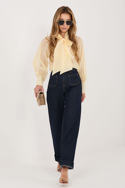 Italy Moda shirt classic cut in soft yellow with bow detail, styled with dark jeans and sunglasses