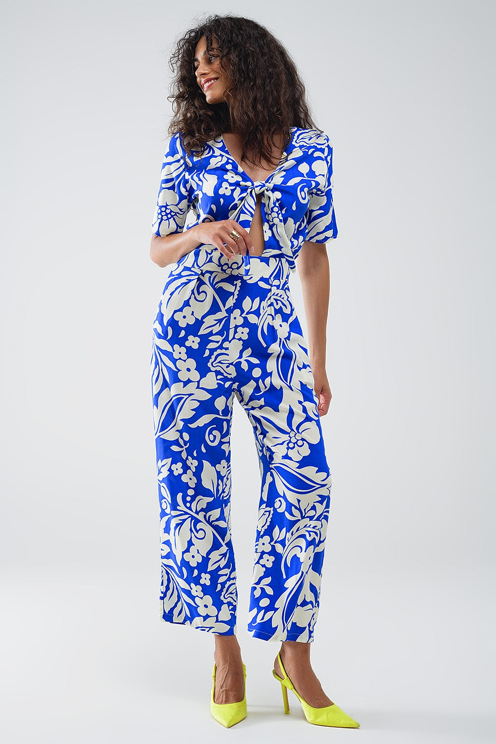 Short Sleeve Key Hole Front Floral Jumpsuit In Blue - Dresses