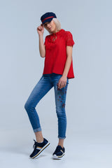 Calça jeans skinny com estampa floral pintada