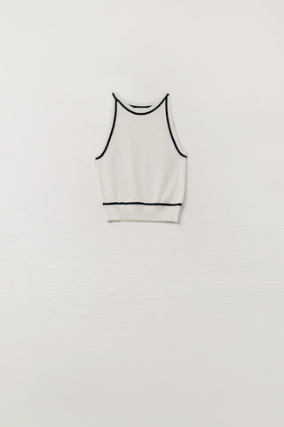 Sleeveless Sweater In White Featuring Black Lines On The Outside
