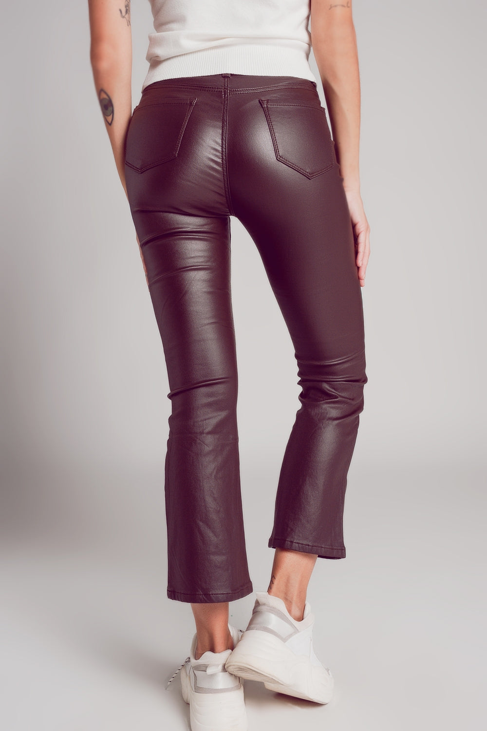 Stretch faux leather flare pants in brown - Trousers
