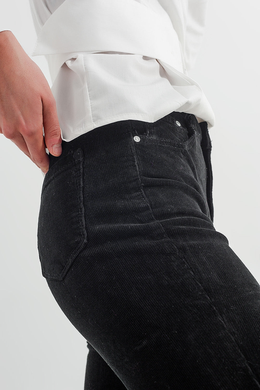 Stretchy cord flared trouser in black - Trousers