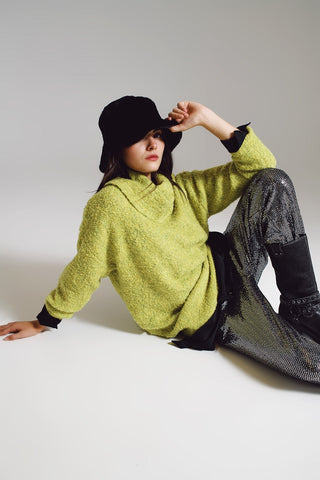 Sweater in green with a bardot neck.