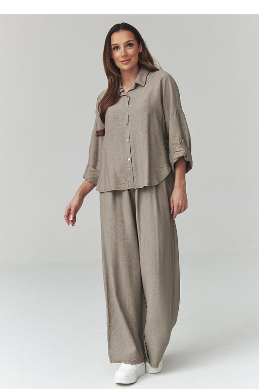 Makadamia outfit set in trendy shades featuring a relaxed fit shirt and wide-leg trousers