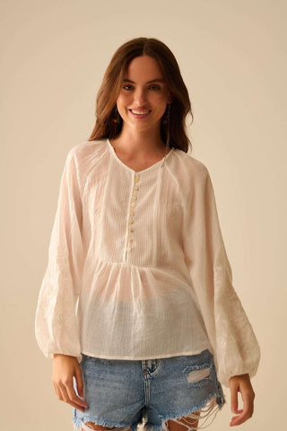 white chiffon blouse with embroidery on the sleeves