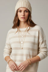 Pull en maille rayée blanche avec détails à sequins