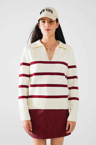 white sweater with dark red stripes and wide v neck