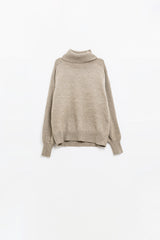 wide beige sweater with ribbed sleeves