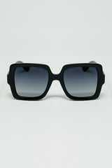 Wide square frame sunglasses with gold detail on the temples