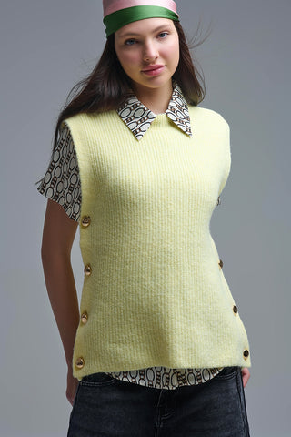 Yellow sleeveless sweater with gold buttons on side