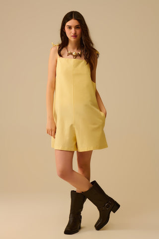 Yellow striped playsuit with shoulder ties and back pocket detail